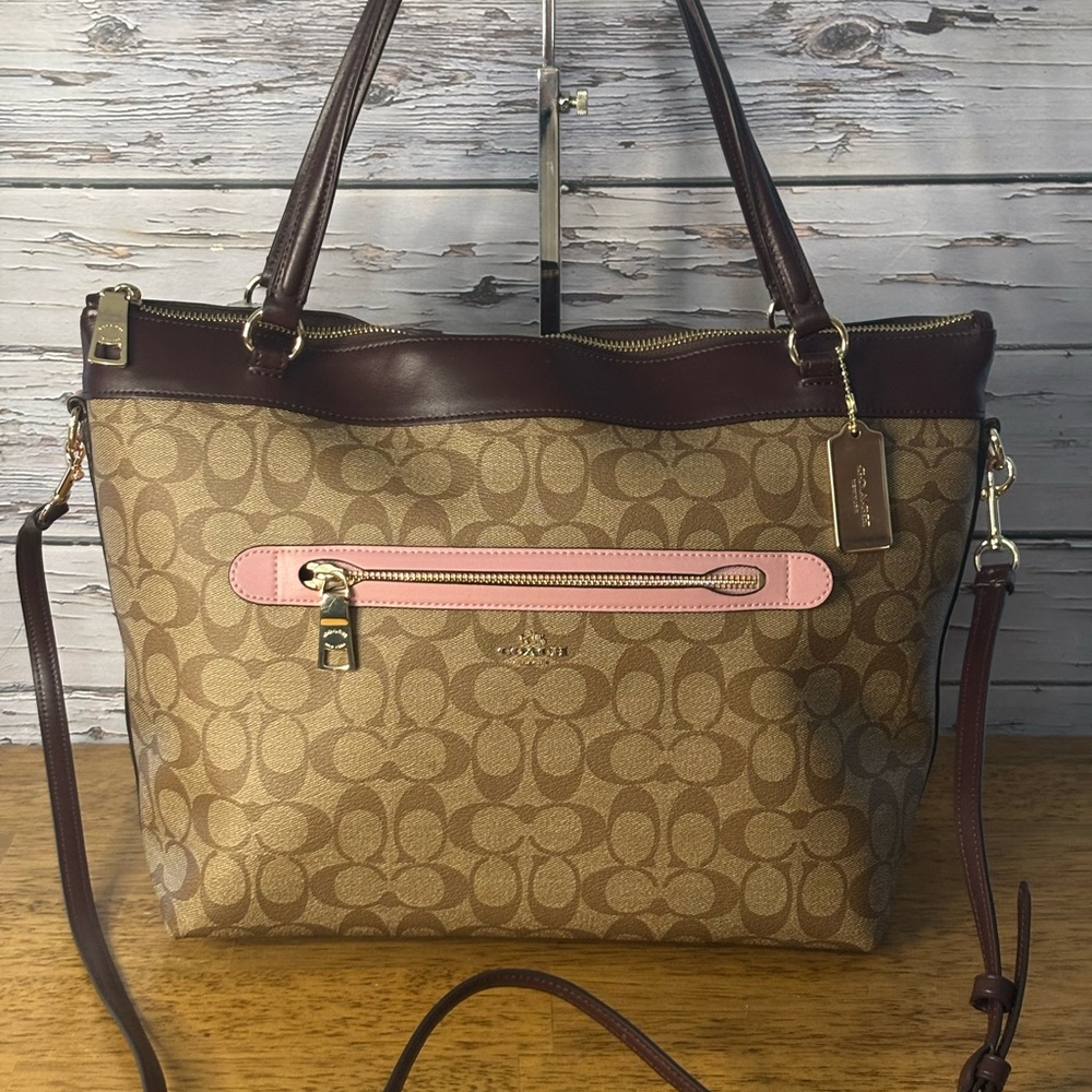 Coach Tyler tote in color block signature coated canvas.